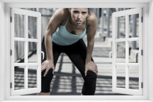 sport woman tired and exhausted breathing and cooling down after running