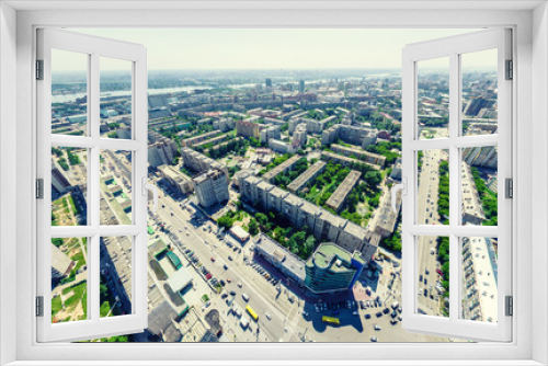 Fototapeta Naklejka Na Ścianę Okno 3D - Aerial city view with crossroads and roads, houses, buildings, parks and parking lots, bridges. Urban landscape. Copter shot. Panoramic image.