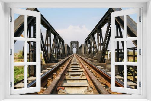 Fototapeta Naklejka Na Ścianę Okno 3D - Steel structure of railway bridge, railway rail with vanishing point, amazing perspective