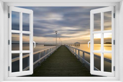 Fototapeta Naklejka Na Ścianę Okno 3D - wooden pier by the sea, long exposure, evening