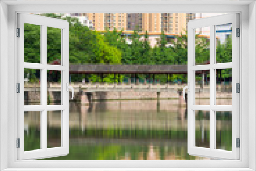 Fototapeta Naklejka Na Ścianę Okno 3D - Residential buildings reflecting in the water in Chengdu - China