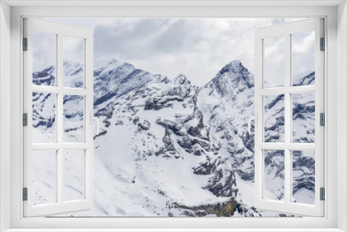 Fototapeta Naklejka Na Ścianę Okno 3D - Landscape of Jungfrau Mountain Range in Switzerland, View of the Eiger, Monch and Jungfrau peaks from the Schilthorn (Piz Gloria), Lauterbrunnen, Bernese Alps, Switzerland, Europe, selective focus