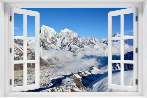 Fototapeta Naklejka Na Ścianę Okno 3D - Majestic view of the Himalayan mountains from Mt. Gokyo Ri. Mountain range covered with snow on the background of blue sky.