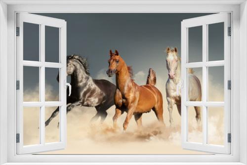 Fototapeta Naklejka Na Ścianę Okno 3D - three horses runs free in desert