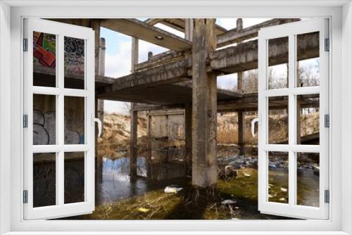 Fototapeta Naklejka Na Ścianę Okno 3D - Abandoned Soviet concrete construction flooded with water