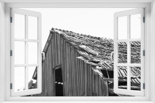 Fototapeta Naklejka Na Ścianę Okno 3D - Old roof. Monochrome photo.