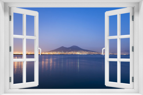 Fototapeta Naklejka Na Ścianę Okno 3D - An amazing  evening in Naples, Tyrrhenian Sea and Mount Vesuvius over city