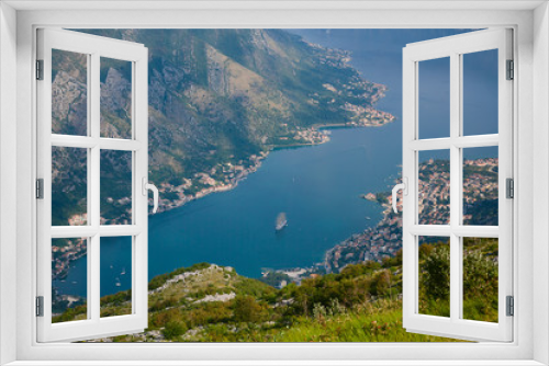 Fototapeta Naklejka Na Ścianę Okno 3D - Bay of Kotor from the heights. View from Mount Lovcen to the bay. View down from the observation platform on the mountain Lovcen. Mountains and bay in Montenegro. The liner near the old town of Kotor.