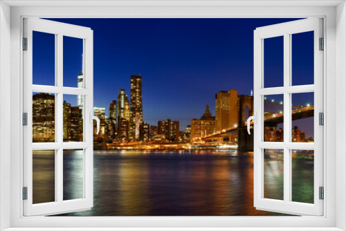 Fototapeta Naklejka Na Ścianę Okno 3D - Panoramic view of Lower Manhattan Financial District skyscrapers at twilight with the Brooklyn Bridge. New York City