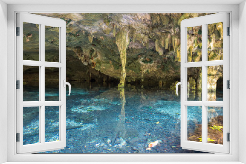 Fototapeta Naklejka Na Ścianę Okno 3D - Bright blue cenote - underground waterhole in a lime stone cave. Tulum, Mexico.