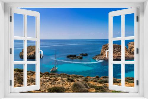 Fototapeta Naklejka Na Ścianę Okno 3D - Comino, Malta - Panoramic skyline view of the  beautiful Blue Lagoon on the island of Comino with sailboats and tourists enjoying the mediterranean sea