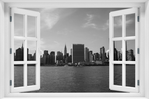 Fototapeta Naklejka Na Ścianę Okno 3D - Buildings in Manhattan and the river in black and white style, New York