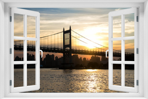 Fototapeta Naklejka Na Ścianę Okno 3D - Triborough bridge and city with sunset in silhouette, New York