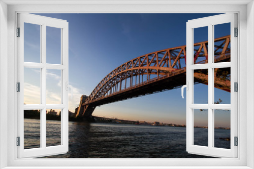 Fototapeta Naklejka Na Ścianę Okno 3D - The Hell Gate Bridge over the river with sunset sky, New York