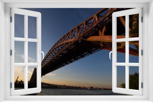 Fototapeta Naklejka Na Ścianę Okno 3D - The Hell Gate Bridge over the river with sunset sky, New York