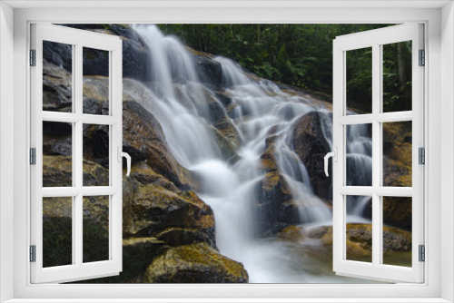 Fototapeta Naklejka Na Ścianę Okno 3D - beautiful in nature, amazing cascading tropical waterfall. wet and mossy rock, surrounded by green rain forest