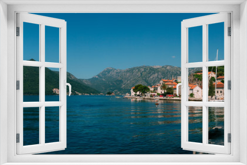 Fototapeta Naklejka Na Ścianę Okno 3D - The old town of Perast on the shore of Kotor Bay, Montenegro. The ancient architecture of the Adriatic and the Balkans. Fishermen's cities of Europe.
