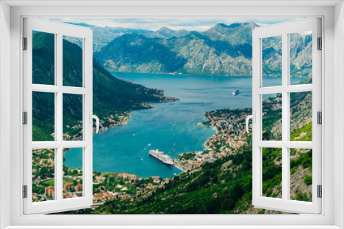 Fototapeta Naklejka Na Ścianę Okno 3D - Bay of Kotor from the heights. View from Mount Lovcen to the bay. View down from the observation platform on the mountain Lovcen. Mountains and bay in Montenegro. The liner near the old town of Kotor.