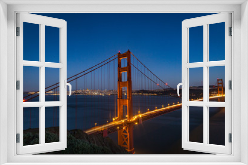 Fototapeta Naklejka Na Ścianę Okno 3D - Aerial view of the Golden Gate bridge in San Fransisco during golden hour and traffic