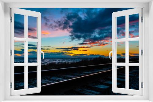 Fototapeta Naklejka Na Ścianę Okno 3D - Tracks a sunset