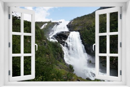 Fototapeta Naklejka Na Ścianę Okno 3D - Waterfall in mountains of Norway in rainy weather.