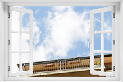 Fototapeta Naklejka Na Ścianę Okno 3D - Balkony with flowers and blue sky in Great Britain