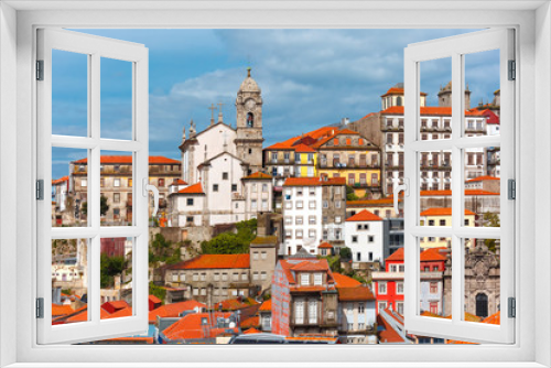 Aerial view with traditional multicolored quaint houses in Old town of Porto in the sunny day, Portugal