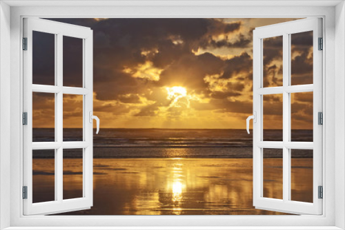 Fototapeta Naklejka Na Ścianę Okno 3D - Golden sunset on the pacific ocean coast, USA/Golden sunset with reflection of clouds on beach