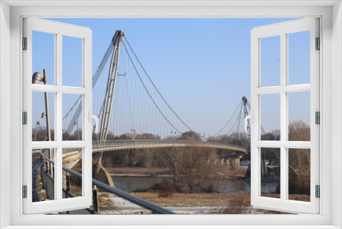 Fototapeta Naklejka Na Ścianę Okno 3D - Herrenkrugsteg, a suspension bridge for pedestrians and cyclists in Magdeburg, Germany