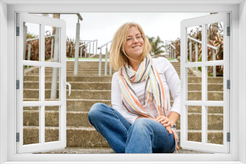 outdoor portrait of young happy girl on neutral urban background