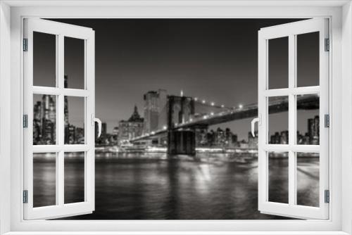 Fototapeta Naklejka Na Ścianę Okno 3D - Panoramic Black and white view of Lower Manhattan Financial District skyscrapers at twilight with the Brooklyn Bridge and East River. New York City