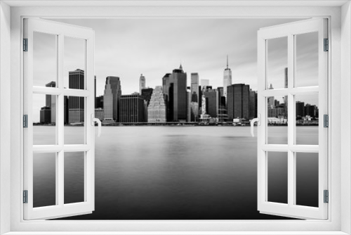 Fototapeta Naklejka Na Ścianę Okno 3D - Manhattan downtown skyline in cloudy day, black and white colors, New York, USA