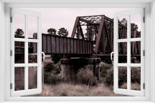 Fototapeta Naklejka Na Ścianę Okno 3D - Old rusty weathered railway bridge
