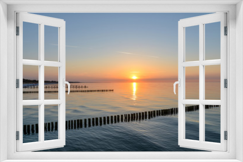 Fototapeta Naklejka Na Ścianę Okno 3D - Sonnenuntergang am Meer Ostsee mit Buhnen