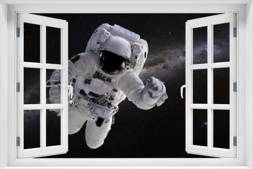 Fototapeta Naklejka Na Ścianę Okno 3D - Astronaut in front of the Milky Way galaxy