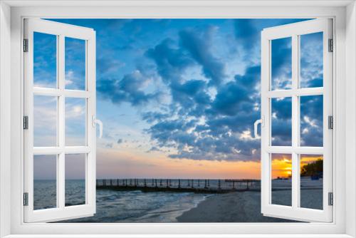 Fototapeta Naklejka Na Ścianę Okno 3D - Old pier on background of sunset on beach