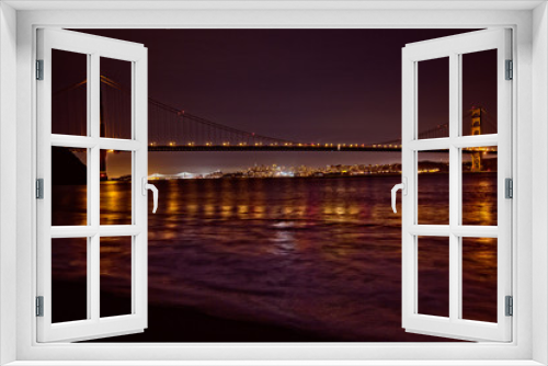 Fototapeta Naklejka Na Ścianę Okno 3D - San Francisco from Kirby Cove with the city skyline viewable underneath the span of the landmark Golden Gate Bridge