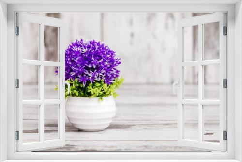 Fototapeta Naklejka Na Ścianę Okno 3D - Artificial Purple Plant in White Flowerpot