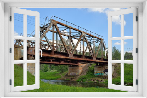 Fototapeta Naklejka Na Ścianę Okno 3D - Railway bridge across the river Oredezh at Vyritsa in the summer
