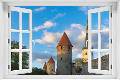 Fototapeta Naklejka Na Ścianę Okno 3D - Fortress towers and St. Olaf's church against blue sky and clouds