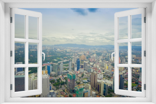 Fototapeta Naklejka Na Ścianę Okno 3D - Beautiful view of Kuala Lumpur from Menara Kuala Lumpur Tower, a commmunication tower and the highest viewpoint in the city that is open to the public