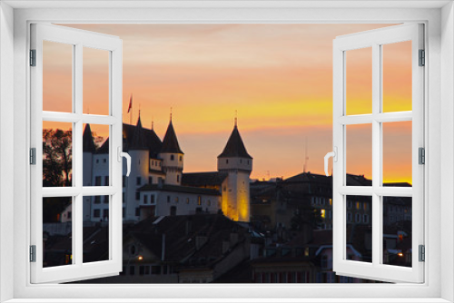 Fototapeta Naklejka Na Ścianę Okno 3D - The medieval Nyon Castle during colorful dusk