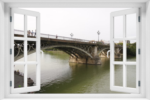 Fototapeta Naklejka Na Ścianę Okno 3D - Pont Isabelle II sur le fleuve Guadalquivir à Séville, Espagne