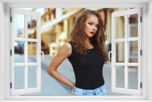 Potrait of beautiful young woman with beautiful curly hair