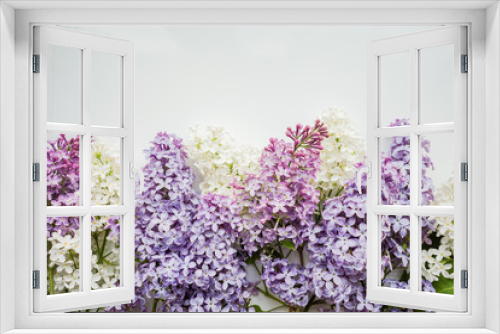 Fototapeta Naklejka Na Ścianę Okno 3D - Branch of lilac on a white background. Design element for card, banners, print. Top view. 