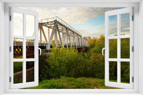 Fototapeta Naklejka Na Ścianę Okno 3D - An Iconic Old Metal Truss Railroad Bridge