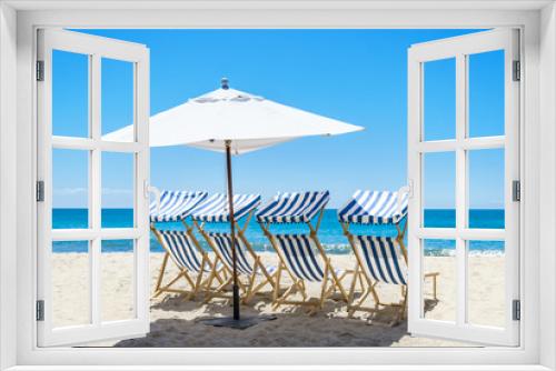 Fototapeta Naklejka Na Ścianę Okno 3D - Beach chairs near the ocean background