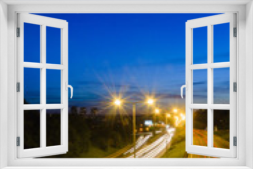 Fototapeta Naklejka Na Ścianę Okno 3D - View on a highway at blue hour, long exposure photography