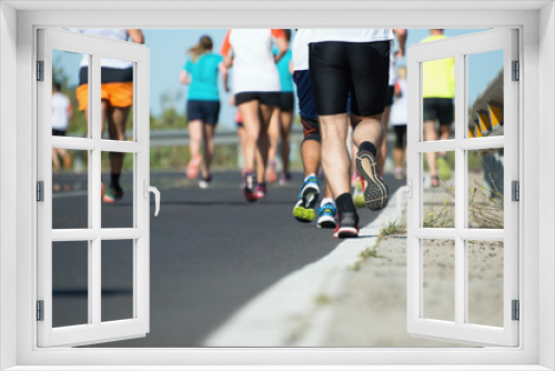 Marathon running race, people feet on road