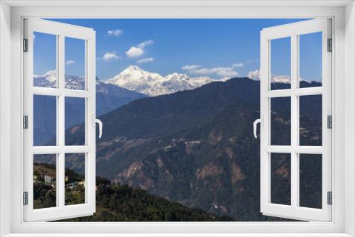 Fototapeta Naklejka Na Ścianę Okno 3D - Kangchenjunga mountain with clouds above and mountain's villages that view in the morning in Sikkim, India